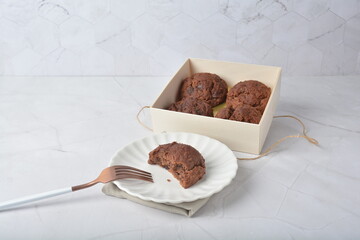 gourmet freshly bake golden Texas sweet chocolate chip honey biscuit cake scone milk butter bread in square bento wood box on white marble table rose gold fork knife pastry halal dessert vegan menu