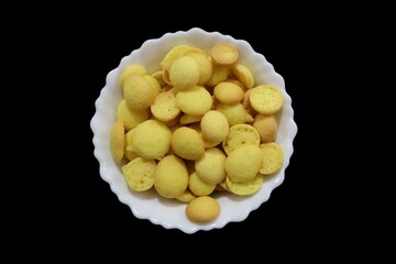 Special Orange and Yellow Crunchy Beans Cookies, commonly known as egg biscuits, are accompanied by Special Kerala Mutta biscuits, Beans biscuits, Coin biscuits, Yellow biscuits, and Baby Biscuits.