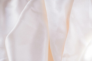 Abstract background of luxury fabric, folded textile or liquid wave or wavy folds silk texture...