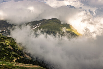 Dramatic clouds engulfing the mountains in Rocky Mountain National Park, Colorado