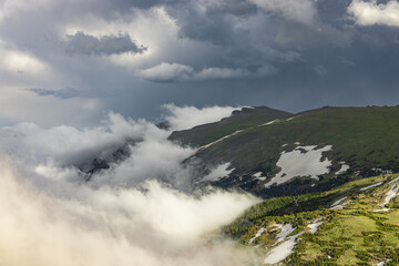 Clouds creeping over the high mountains in Rocky Mountain National Park, Colorado