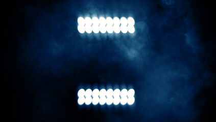 Divine blue light through a dark fog. The rays beam light on the floor. Spotlight on isolated background. Stock illustration.