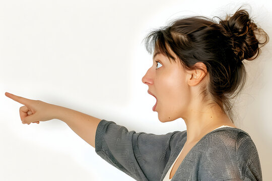 a woman pointing forward, she has a surprisedlook on her face and her mouth is wide open, white background