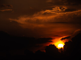 Yellow Sunset between Clouds at The Countryside of Twilight Time