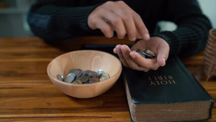 Close up hands people church congregants placing Money on an offering basket.