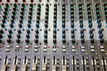 Volume and equalization controls on professional mixing console
