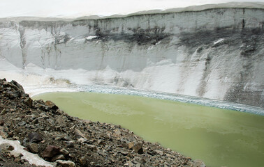 a lake in the mountains formed due to the melting of a glacier