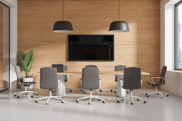 Cozy meeting interior with table and chairs, tv display and panoramic window