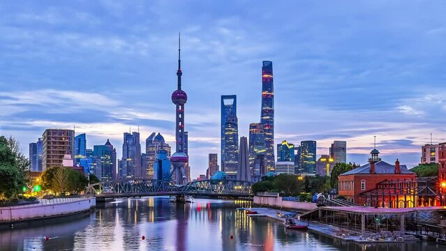 Day to night time-lapse shot of downtown city architectural landscape in Shanghai