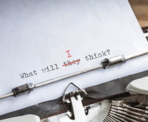 Typewriter with typed text WHAT WILL THEY THINK? replaced THEY with I, concept of overcoming approval addiction, stop caring what others think and build self respect