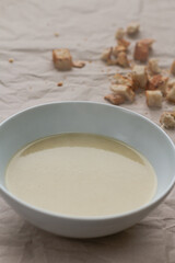 Leeks in a cream soup bowl.