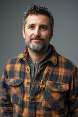 Handsome smiling, happy and pleased stoic man with positive vibes. Portrait of a joyful young man with beautiful hair and fashionable clothes.