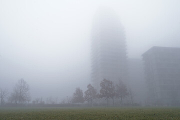 View of a glimpse of the outskirts of Milan in a foggy morning day. Milan, Italy