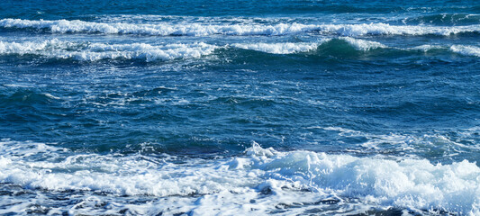 Ocean waves on sunny day, Splashing Waves. Blue clean wavy sea water