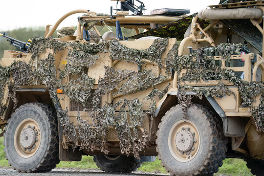 close-up of a British army Supacat Jackal 4x4 rapid assault, fire support and reconnaissance vehicle, in action on a military exercise, Wilts UK