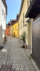 Rolgordijnen narrow street in the town © Wallace