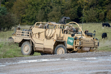 British army Supacat Jackal 4x4 rapid assault, fire support and reconnaissance vehicle, in action...