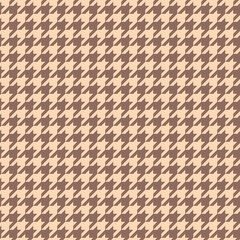 Brown Houndstooth Pattern. Typically created using a combination of alternating dark and light colored threads, the houndstooth pattern is often found in fabrics such as wool, tweed, and cotton.