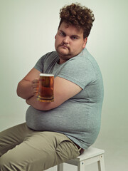 Portrait, arms crossed and plus size man with alcohol for unhealthy habit, serious and weight gain...