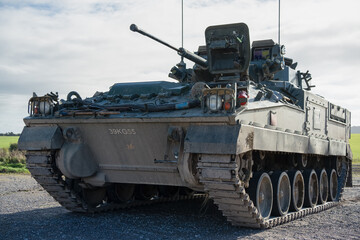 Fototapeta na wymiar British army Warrior FV510 IFV in action on a military exercise, Wilts UK