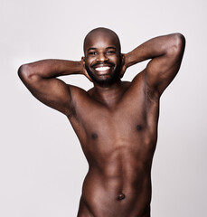 Happy black man, portrait and abdomen muscle in studio for sports, workout and exercise of bodybuilder isolated on white background. Face, strong abs and naked or topless African person with health