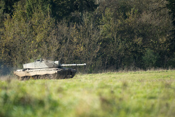 Commander and gunner directing a British army Challenger 2 II FV4034 main battle tank in action on a military exercise, Wilts UK
