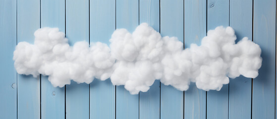 Image of cotton shaped clouds over blue wooden background