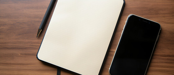 Image of open notebook with blank pages next to smartp