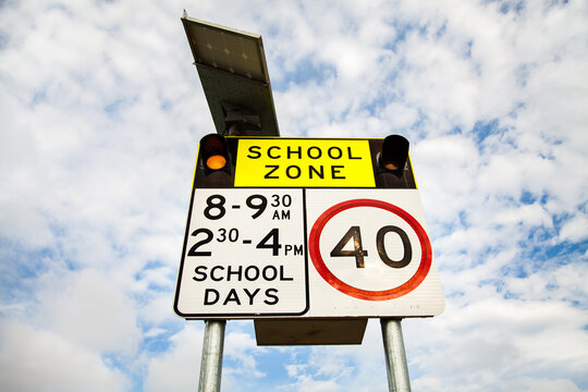 40 School zone sign with lights on