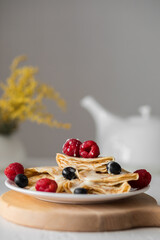 Pancakes with berries for breakfast. Still life