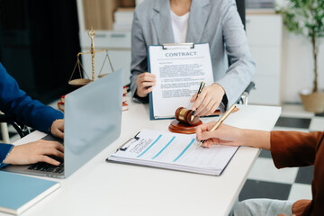 Asian team and lawyers discussing contract papers coworker, teamwork celebrating achievement.Concepts