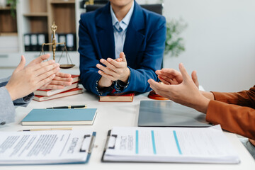 Asian team and lawyers discussing contract papers coworker, teamwork celebrating achievement.Concepts