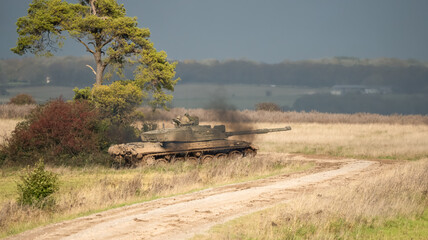 Commander and gunner directing a British army Challenger 2 II FV4034 main battle tank in action on...