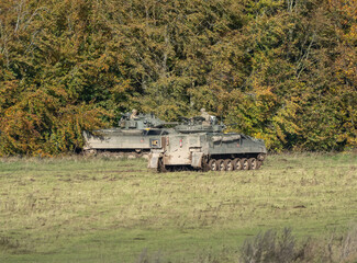 British army Warrior FV510 Infantry Fighting Vehicles in action on a military exercise, Wilts UK