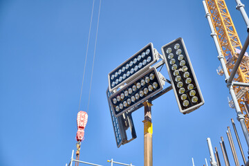 Mobile lighting tower at construction site. Industrial lighting stand 
