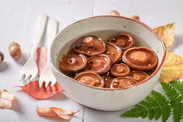 Fresh saffron milk cup mushrooms in vinegar pickle with charlock. - 759640160