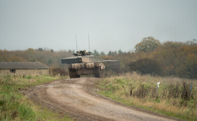 Fototapeta premium British army Challenger 2 II FV4034 main battle tank in action on a military exercise, taking aim
