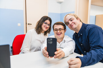 In a moment of joy, coworkers, one with Down syndrome, snap a selfie.