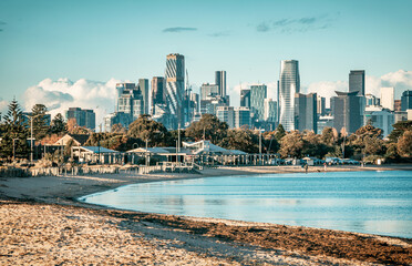 The view of the coast and beaches in Port Melbourne and the urban skyline of the Melbourne CBD in...