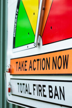take action now total fire ban signage on fire station wall