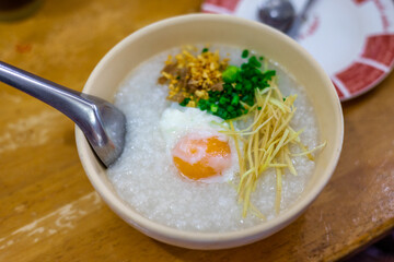 The background of the food menu includes boiled sea bass, pork leg rice, and delicious flavors while traveling.