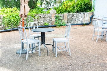 Cafe exterior with empty table and chair at outside Restaurant.
