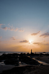 Sunset at a cross by the beach