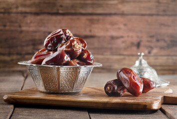 Dates fruit on wooden background