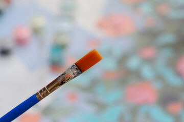 selective focus Phukal, orange fur, blue handle watercolor practicing drawing in her free time to...