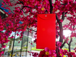 Chinese New Year spring festival Red envelope decoration on orange tree, best wishes for Chinese...