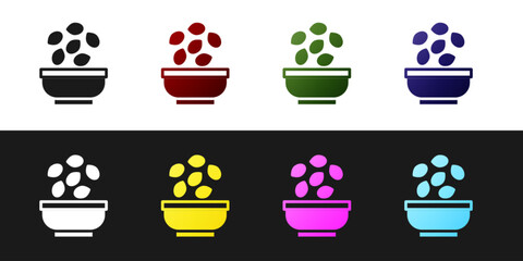 Set Seeds in bowl icon isolated on black and white background. Vector