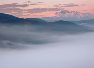 Papier Peint photo Tatras Landscape in the morning. There is fog in the valley. View of the Tatra Mountains from the Pieniny Mountain Range. Slovakia.