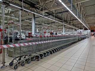trolleys for goods stand in a supermarket
