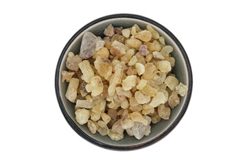 Overhead view of Frankincense from Yemen (Boswellia carterii) in a grey ceramic bowl, also known as...